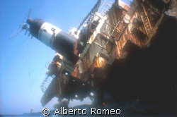 THE WRECK AND THE DIVER SNORKELING by Alberto Romeo 